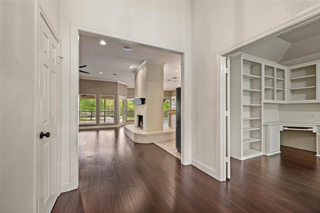 hall with ornamental molding, baseboards, recessed lighting, and dark wood finished floors