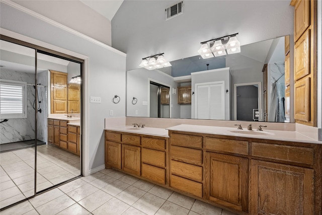 bathroom featuring a sink, visible vents, curtained shower, and vaulted ceiling