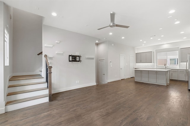 4914 Live Oak St Unit 7, Dallas, TX 75206 - unfurnished living room with ceiling fan, dark wood-style flooring, recessed lighting, stairway, and baseboards
