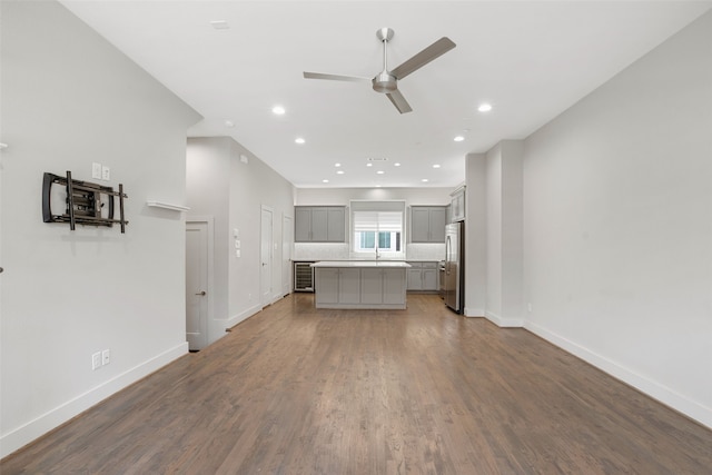 4914 Live Oak St Unit 7, Dallas, TX 75206 - unfurnished living room with a ceiling fan, baseboards, wood finished floors, recessed lighting, and a sink