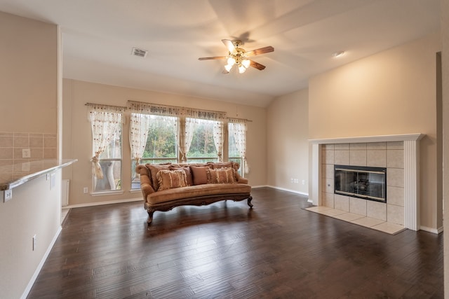 2515 Cambridge Dr, Heath, TX 75032 - living area featuring ceiling fan, dark wood finished floors, a tiled fireplace, and baseboards