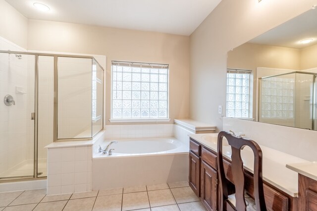 2515 Cambridge Dr, Heath, TX 75032 - bathroom featuring double vanity, a walk in closet, tile patterned flooring, and baseboards