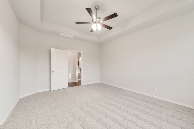 3523 Columbus St, Gainesville, TX 76240 - unfurnished room featuring carpet floors, a tray ceiling, and baseboards