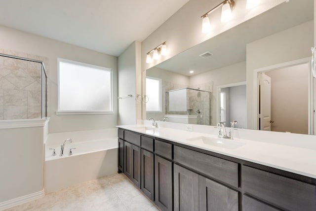 3523 Columbus St, Gainesville, TX 76240 - full bath featuring a garden tub, a tile shower, and double vanity