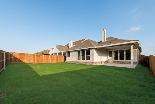 3523 Columbus St, Gainesville, TX 76240 - back of property featuring brick siding, a patio, a chimney, and a shingled roof
