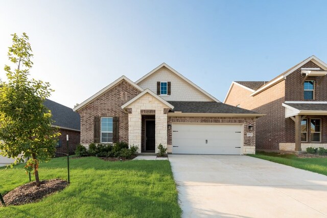 3523 Columbus St, Gainesville, TX 76240 - view of front of property with an attached garage, a front lawn, concrete driveway, brick siding, and stone siding