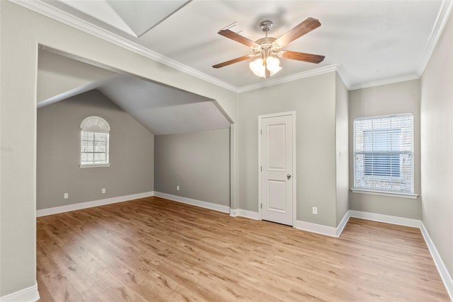 bonus room featuring light wood finished floors, baseboards, lofted ceiling, and a ceiling fan