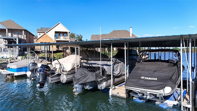 dock area featuring a water view and boat lift