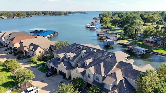 drone / aerial view featuring a water view and a residential view