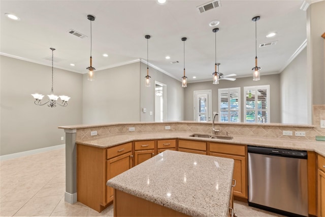 kitchen featuring stainless steel dishwasher, visible vents, decorative backsplash, and a sink