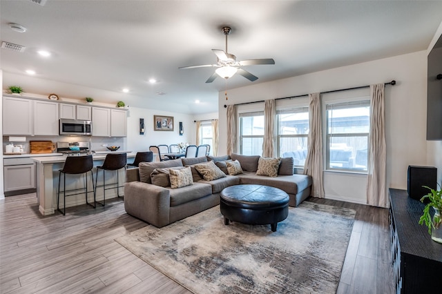 799 Bayberry Ln, Princeton, TX 75407 - living room with visible vents, a ceiling fan, light wood finished floors, and recessed lighting