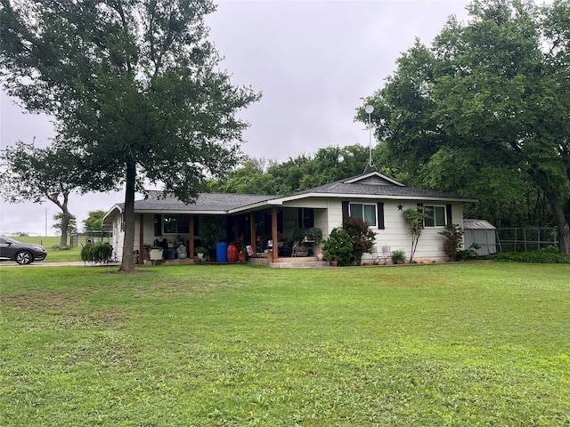 view of front of house with a porch and a front yard