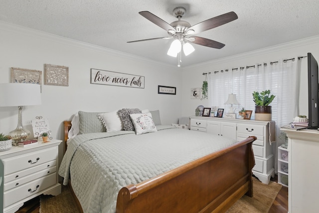 bedroom with a ceiling fan, dark wood finished floors, crown molding, and a textured ceiling