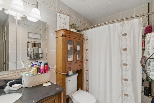 bathroom featuring toilet, a shower with curtain, tile walls, a textured ceiling, and tasteful backsplash