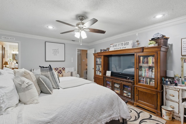 bedroom featuring ornamental molding, ceiling fan, and a textured ceiling