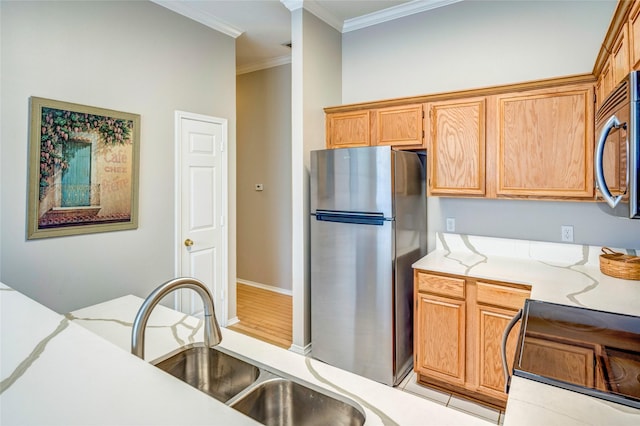 775 Marble Canyon Cir, Irving, TX 75063 - kitchen featuring a sink, stainless steel appliances, ornamental molding, light stone countertops, and baseboards