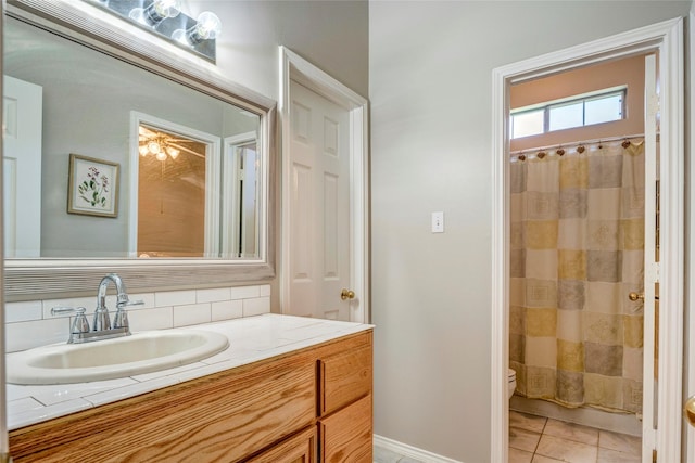 775 Marble Canyon Cir, Irving, TX 75063 - bathroom with toilet, tasteful backsplash, vanity, tile patterned floors, and baseboards