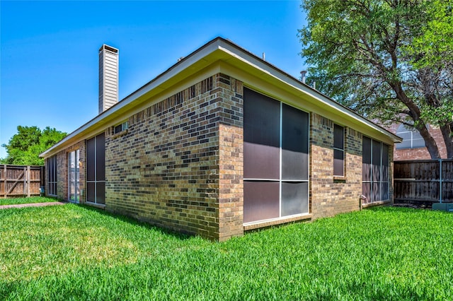 775 Marble Canyon Cir, Irving, TX 75063 - view of side of home featuring brick siding, fence, and a lawn