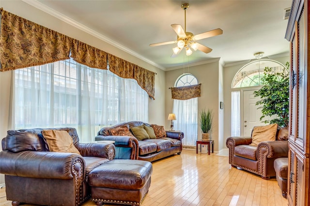 775 Marble Canyon Cir, Irving, TX 75063 - living room featuring ornamental molding, light wood-style floors, visible vents, and ceiling fan
