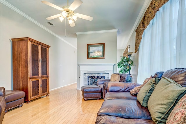 775 Marble Canyon Cir, Irving, TX 75063 - living room featuring crown molding, ceiling fan, visible vents, and light wood-style floors