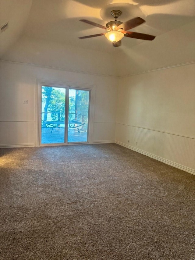 316 Oak Ln, Tool, TX 75143 - carpeted spare room with ceiling fan, a decorative wall, and wainscoting