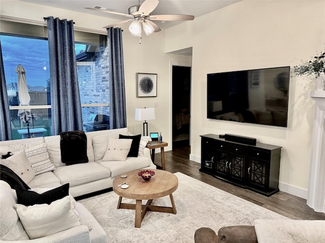 2312 Camp St, Aubrey, TX 76227 - living area with wood finished floors, ceiling fan, and baseboards