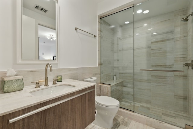 full bathroom featuring visible vents, a stall shower, and toilet