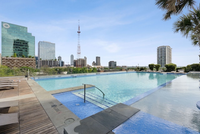 community pool featuring a city view