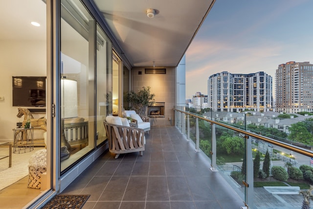 balcony at dusk with a city view