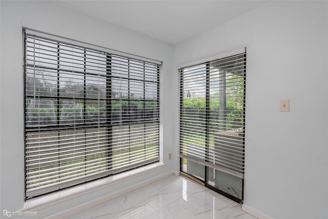 3100 Fairfield Ave Unit 8B, Shreveport, LA 71104 - unfurnished dining area featuring light marble finish floors and baseboards