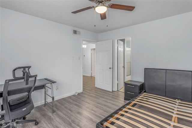 3100 Fairfield Ave Unit 8B, Shreveport, LA 71104 - bedroom featuring wood finished floors, an office area, baseboards, and a ceiling fan