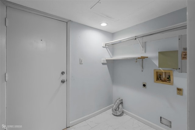 3100 Fairfield Ave Unit 8B, Shreveport, LA 71104 - laundry area featuring hookup for an electric dryer, washer hookup, marble look tiles, and baseboards