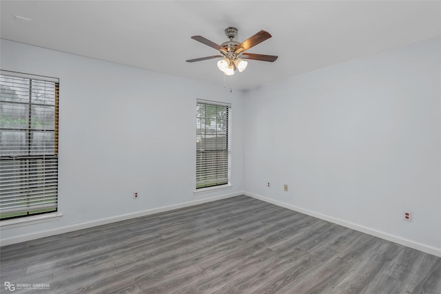 3100 Fairfield Ave Unit 8B, Shreveport, LA 71104 - unfurnished room featuring wood finished floors, baseboards, and a ceiling fan