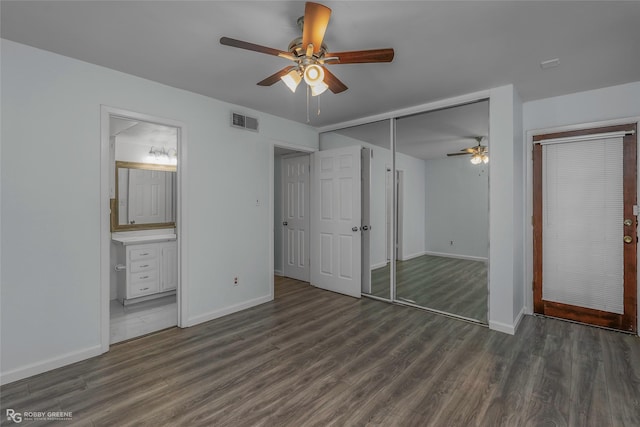 3100 Fairfield Ave Unit 8B, Shreveport, LA 71104 - unfurnished bedroom featuring wood finished floors, baseboards, and ensuite bathroom