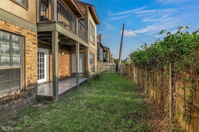 3100 Fairfield Ave Unit 8B, Shreveport, LA 71104 - view of side of property with a balcony, brick siding, and a patio