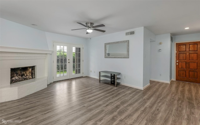 3100 Fairfield Ave Unit 8B, Shreveport, LA 71104 - unfurnished living room featuring a ceiling fan, wood finished floors, baseboards, a fireplace, and recessed lighting