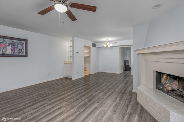 3100 Fairfield Ave Unit 8B, Shreveport, LA 71104 - unfurnished living room featuring a fireplace, dark wood-style flooring, a chandelier, ceiling fan, and baseboards