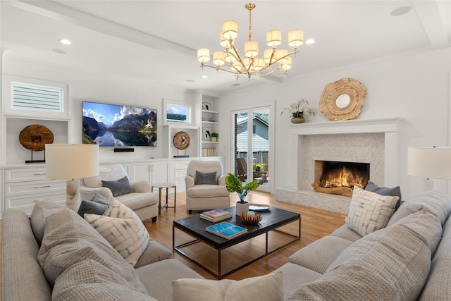 6946 Southridge Dr, Dallas, TX 75214 - living area featuring a chandelier, built in shelves, wood finished floors, a premium fireplace, and recessed lighting