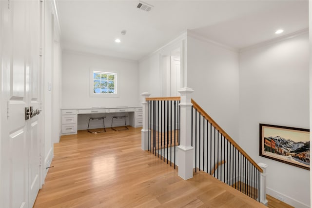 6946 Southridge Dr, Dallas, TX 75214 - hall with an upstairs landing, crown molding, light wood finished floors, an office area, and recessed lighting