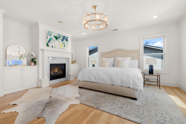 6946 Southridge Dr, Dallas, TX 75214 - bedroom featuring a chandelier, ornamental molding, wood finished floors, a fireplace, and baseboards