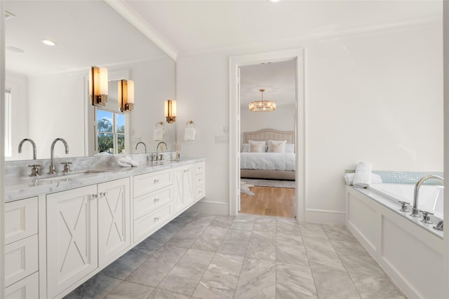 6946 Southridge Dr, Dallas, TX 75214 - bathroom featuring double vanity, a chandelier, crown molding, connected bathroom, and a bath