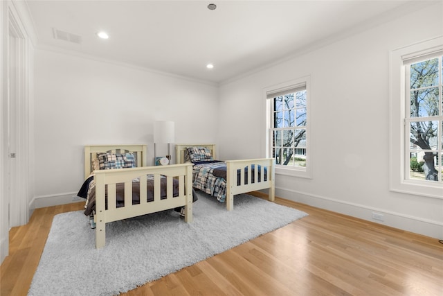 6946 Southridge Dr, Dallas, TX 75214 - bedroom featuring wood finished floors, baseboards, ornamental molding, and recessed lighting