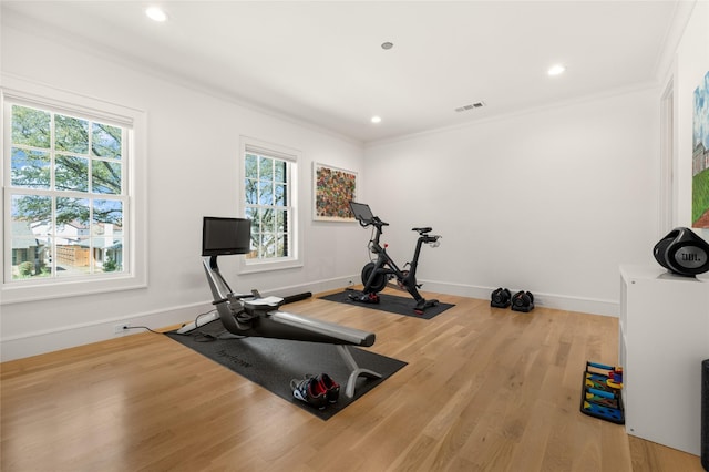6946 Southridge Dr, Dallas, TX 75214 - workout area featuring healthy amount of natural light, wood finished floors, crown molding, recessed lighting, and baseboards