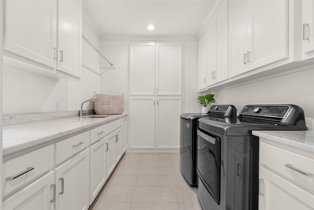 6946 Southridge Dr, Dallas, TX 75214 - washroom with washer and dryer, cabinet space, and recessed lighting