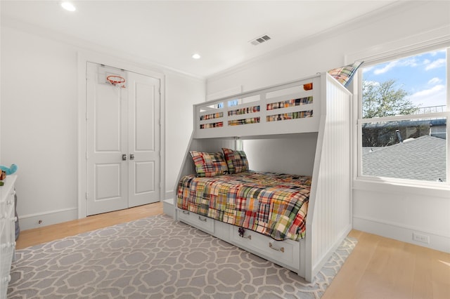6946 Southridge Dr, Dallas, TX 75214 - bedroom featuring light wood-style floors, recessed lighting, a closet, baseboards, and crown molding
