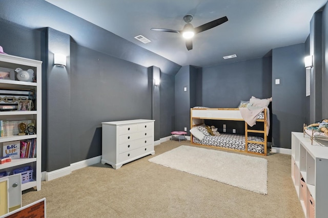 carpeted bedroom with baseboards, ceiling fan, and visible vents