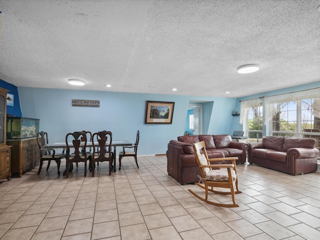 living room featuring a textured ceiling, recessed lighting, and light tile patterned floors
