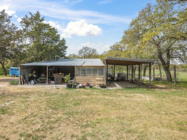 exterior space with an outbuilding and a detached carport