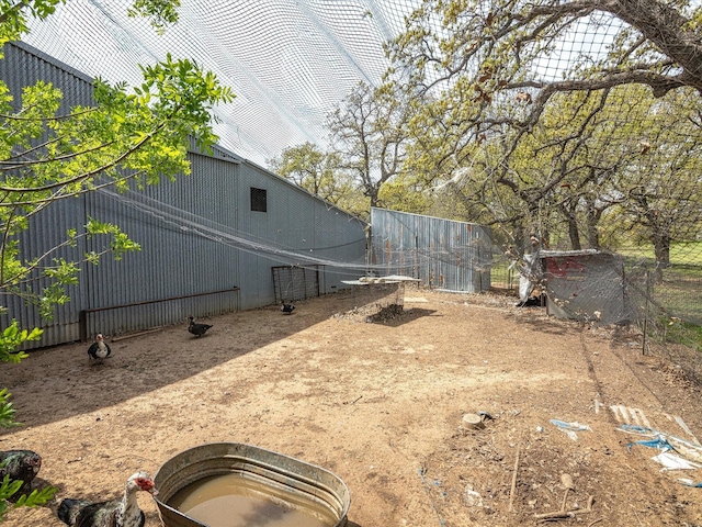 view of yard with an outbuilding and a pole building
