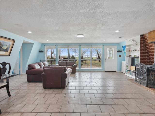 tiled living area with a wealth of natural light, built in features, and a textured ceiling